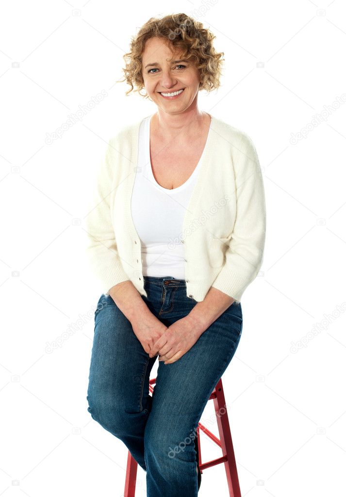 Full length view of seated senior woman
