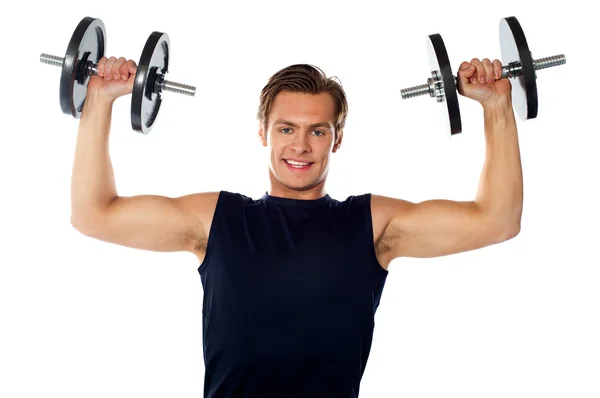 Caucasian athlete exercising in sporty outfits — Stock Photo, Image