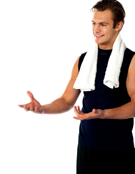 Male trainer posing with open hands and looking away — Stock Photo, Image