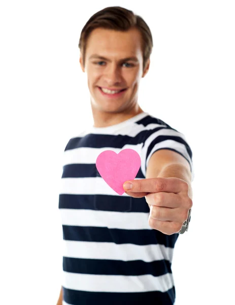 Young man ofering his paper heart to you — Stock Photo, Image