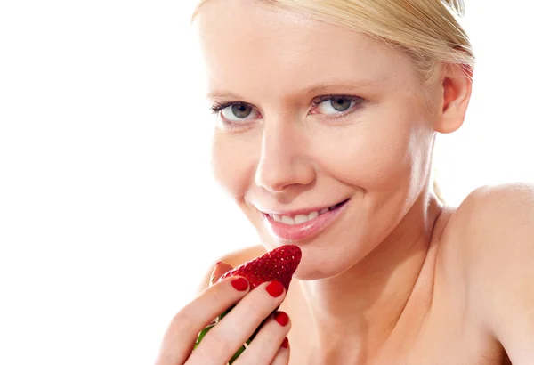 Closeup of young gorgeous girl holding strawberry — Stock Photo, Image