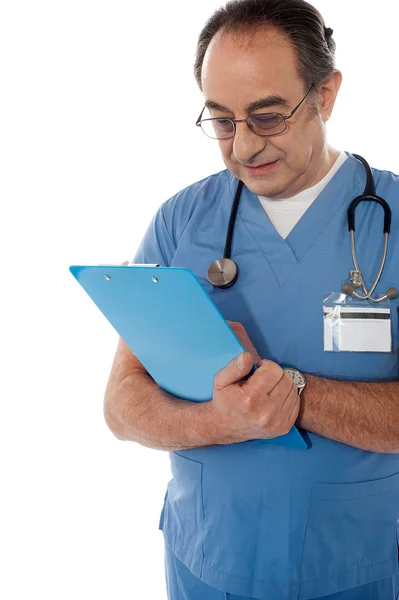 Medical specialist studying report — Stock Photo, Image