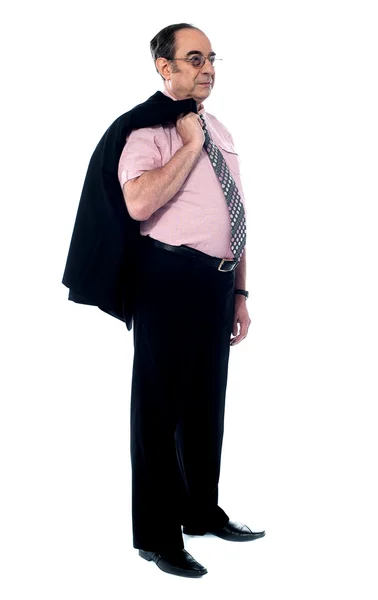 Senior executive holding his coat over shoulders — Stock Photo, Image
