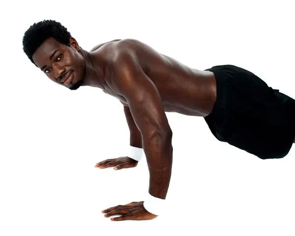 Handsome fit shirtless man doing pushups — Stock Photo, Image