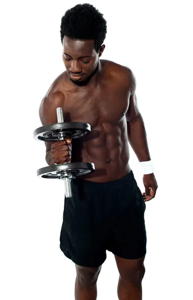 Young man doing biceps excercise — Stock Photo, Image