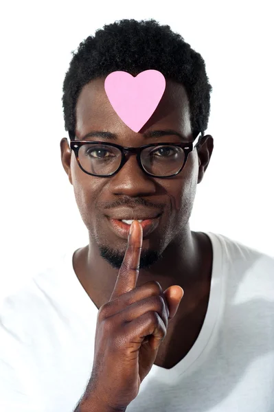 Man with pape heart on forehead gesturing silence — Stock Photo, Image