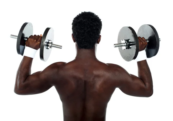 Bakifrån av en ung manlig bodybuilder — Stockfoto
