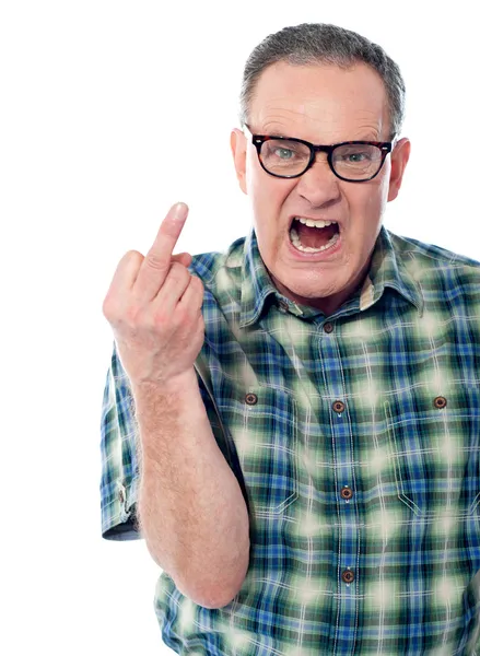 Image of a displeased man showing middle finger — Stock Photo, Image