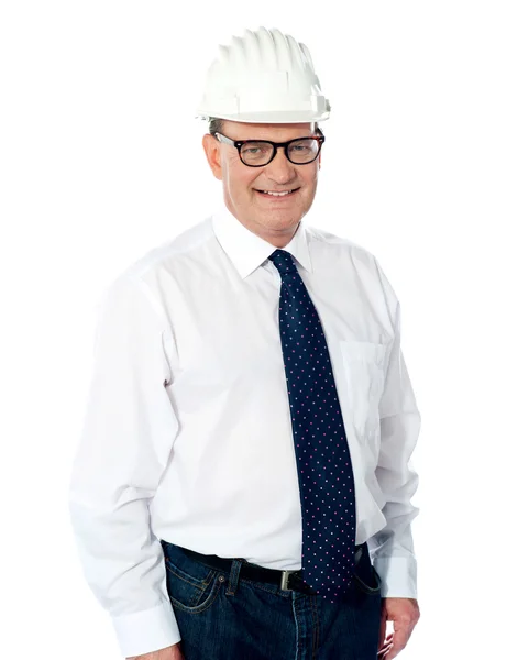 Handsome smiling aged engineer with hard hat — Stock Photo, Image