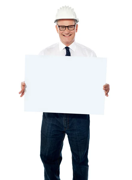 Senior architect holding blank billboard — Zdjęcie stockowe