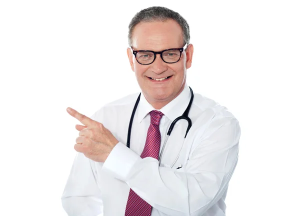 Medical professional pointing away — Stock Photo, Image