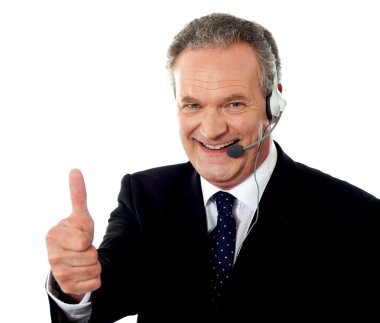 Call centre executive smiling with thumbs-up clipart