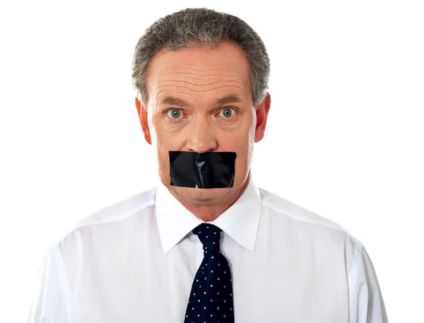 Businessman with taped mouth — Stock Photo, Image