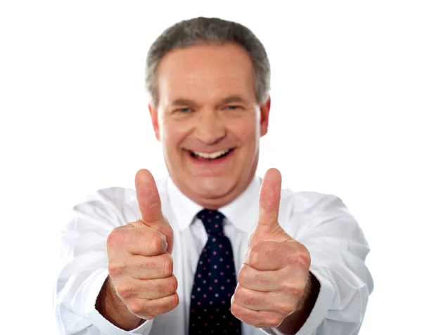 Happy businessman gesturing double thumbs-up — Stock Photo, Image