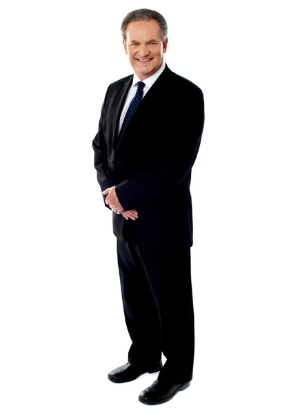 Porträt eines leitenden Geschäftsmannes in voller Länge — Stockfoto