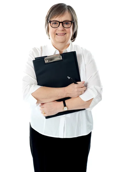Portrait of senior businesswoman holding reports — Stock Photo, Image