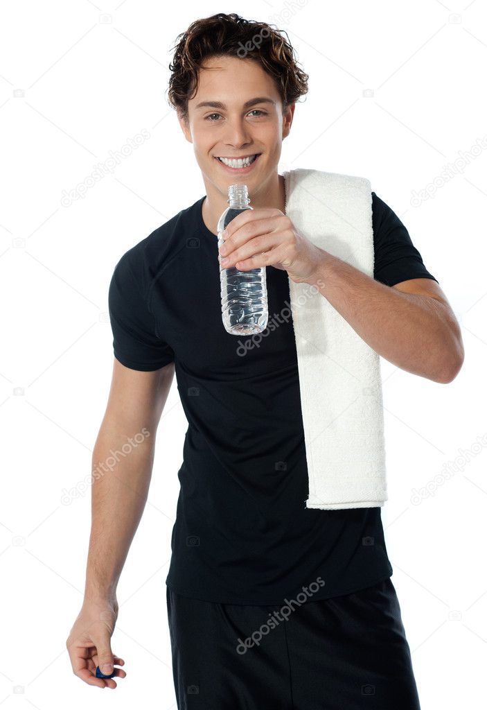 Fit man drinking water isolated on white