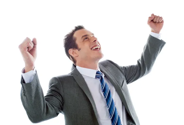 Empresario celebrando el éxito con los brazos en alto — Foto de Stock