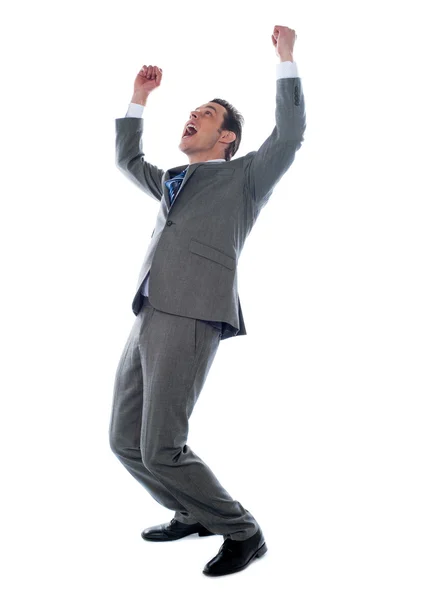 Başarılı bir iş adamı yukarı kolları ile kutluyor — Stok fotoğraf