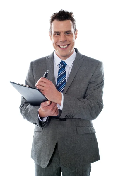 Businessman with clipboard Stock Picture