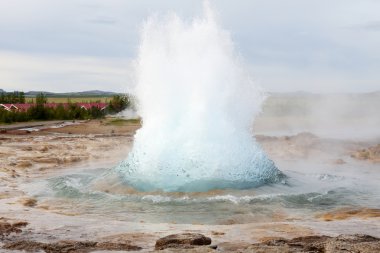 The Strokkur geyser erupting clipart