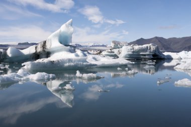 Floating icebergs in Jokulsarlon Iceland clipart