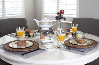 Dining table laid for breakfast clipart