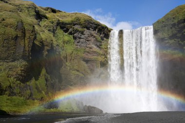 Rainbow at waterfall clipart