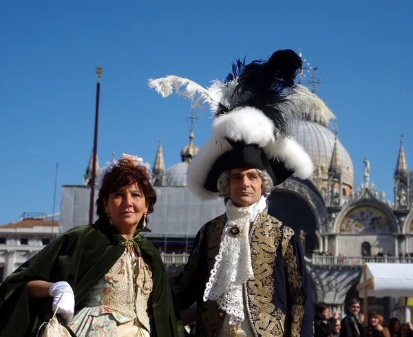 Two in feathers on San Marko Square — Stock Photo, Image