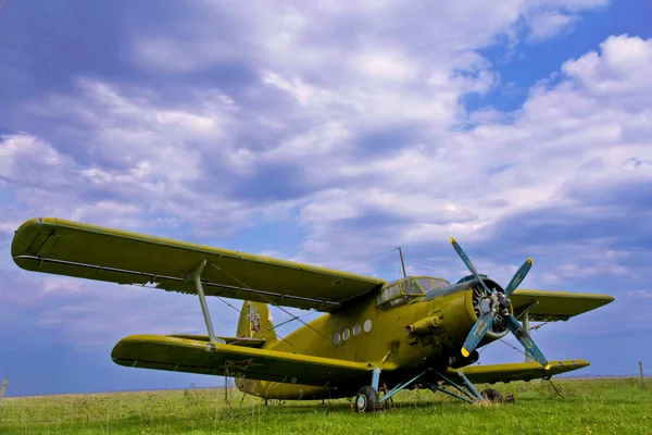 The old plane in the field Stock Photo