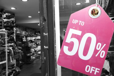 Sale signs in shop window clipart
