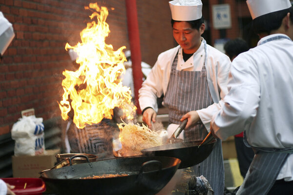 Chinese chefs work at the Chinese New Year celebrations Royalty Free Stock Images