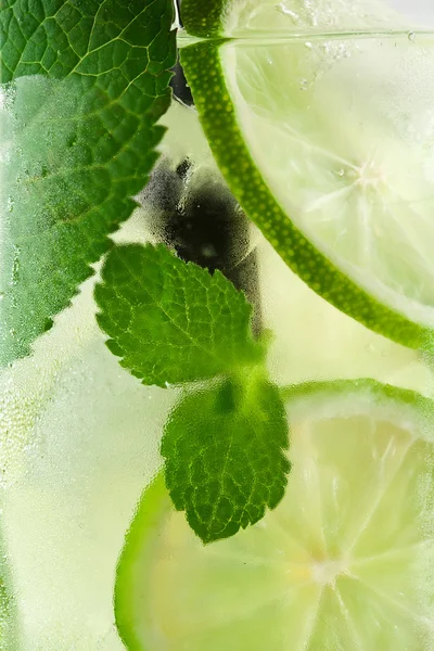 Cold glass with mojito close up background — Stok fotoğraf
