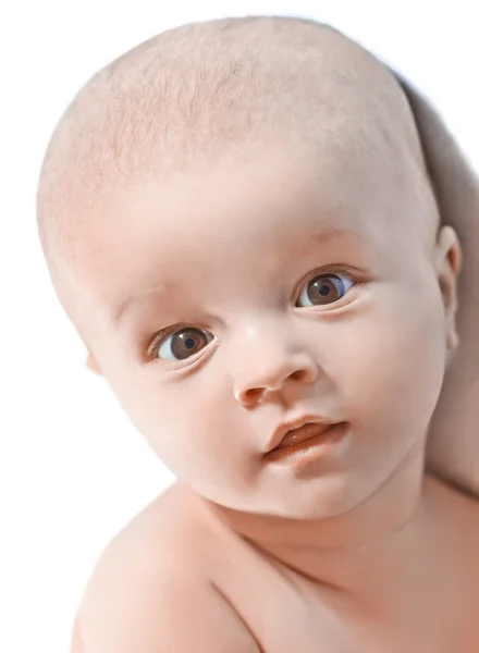 Retrato de un pequeño bebé hermoso en blanco — Foto de Stock