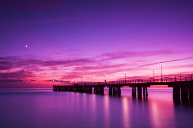 Pier at sunset clipart