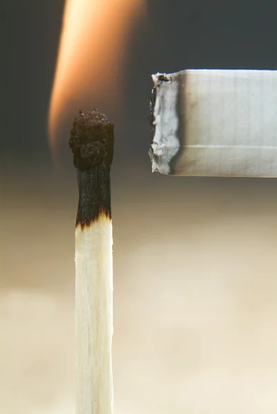 Fire to a cigarette — Stock Photo, Image