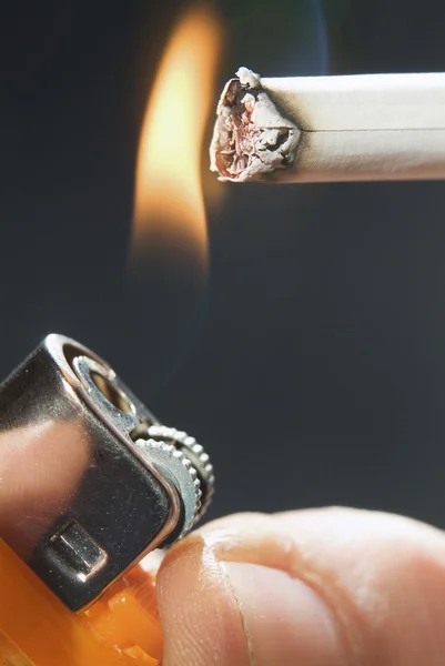 Fire to a cigarette — Stock Photo, Image
