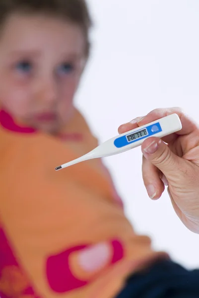 Stock image Sick child measuring fever