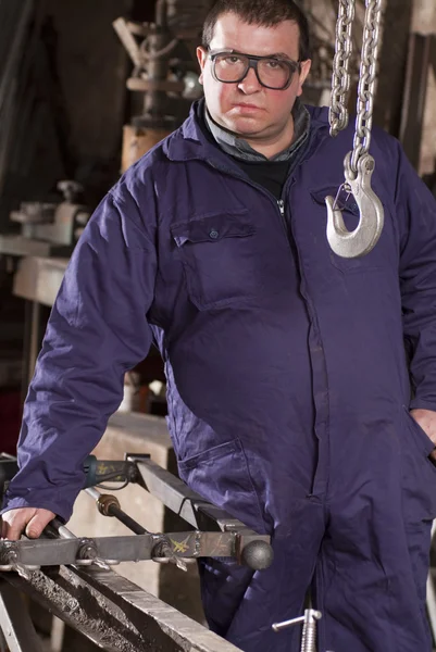 Blacksmith in his workshop — Stock Photo, Image