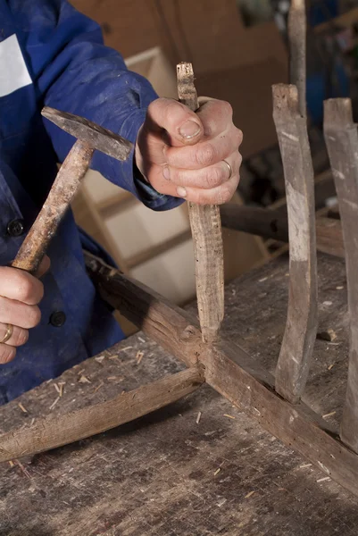 Carpenter repairing chair — Stock Photo, Image