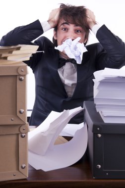 Businessman stressed in his office clipart