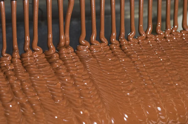 Bundles of liquid chocolate — Stock Photo, Image