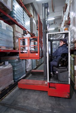 Forklift in a warehouse clipart