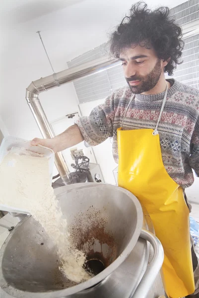 Brewer puts the spice in the still — Stock Photo, Image