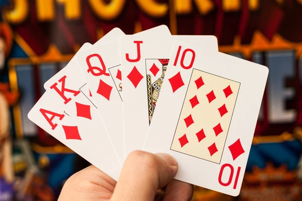 Royal flush cards holding in hands — Stock Photo, Image