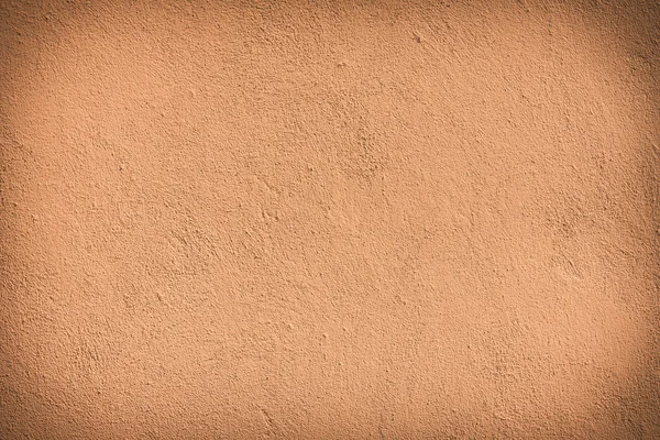Písečná hnědé omítnutá zeď s texturou, starý — Stock fotografie