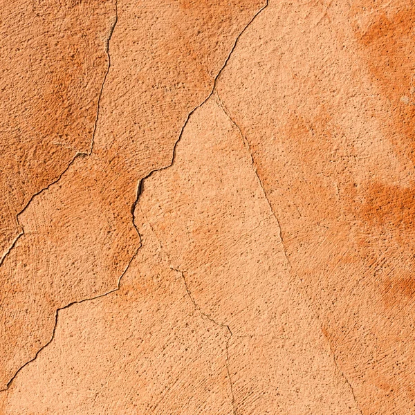 Cracked laranja parede textura fundo — Fotografia de Stock