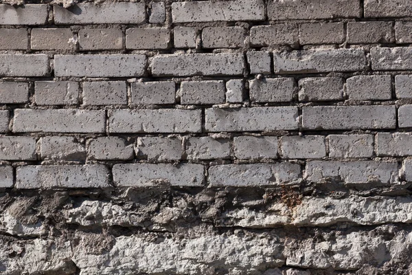 New bricks on top of old stones — Stock Photo, Image