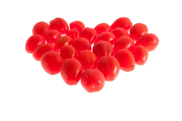 Tomate cereja vermelha formando coração — Fotografia de Stock