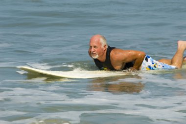 Senior on Surfboard clipart
